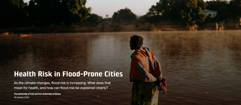 African woman standing in flood waters